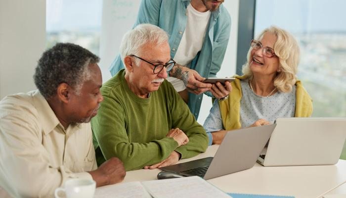 group of seniors working on computers